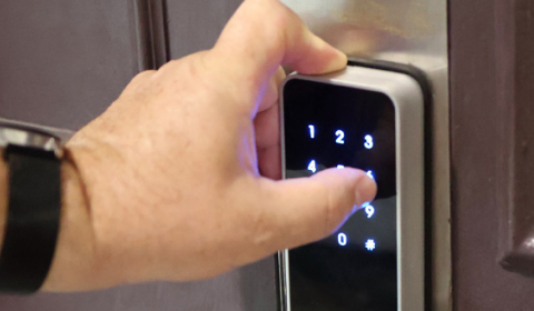 Entering a code on a smart door lock keypad