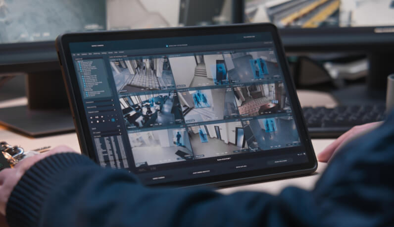 Security operator reviewing camera feeds during video-verified alarm monitoring