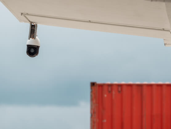 Security camera covering a Carrollton distribution yard and containers