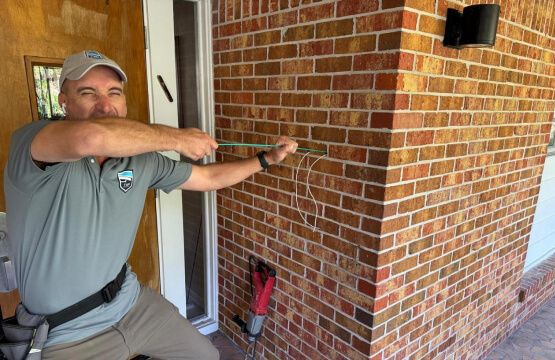 dallas-alarm-systems-technician-installing-security-system-dfw-img Dallas Alarm Systems technician installing a security system at a property in the Dallas-Fort Worth metro