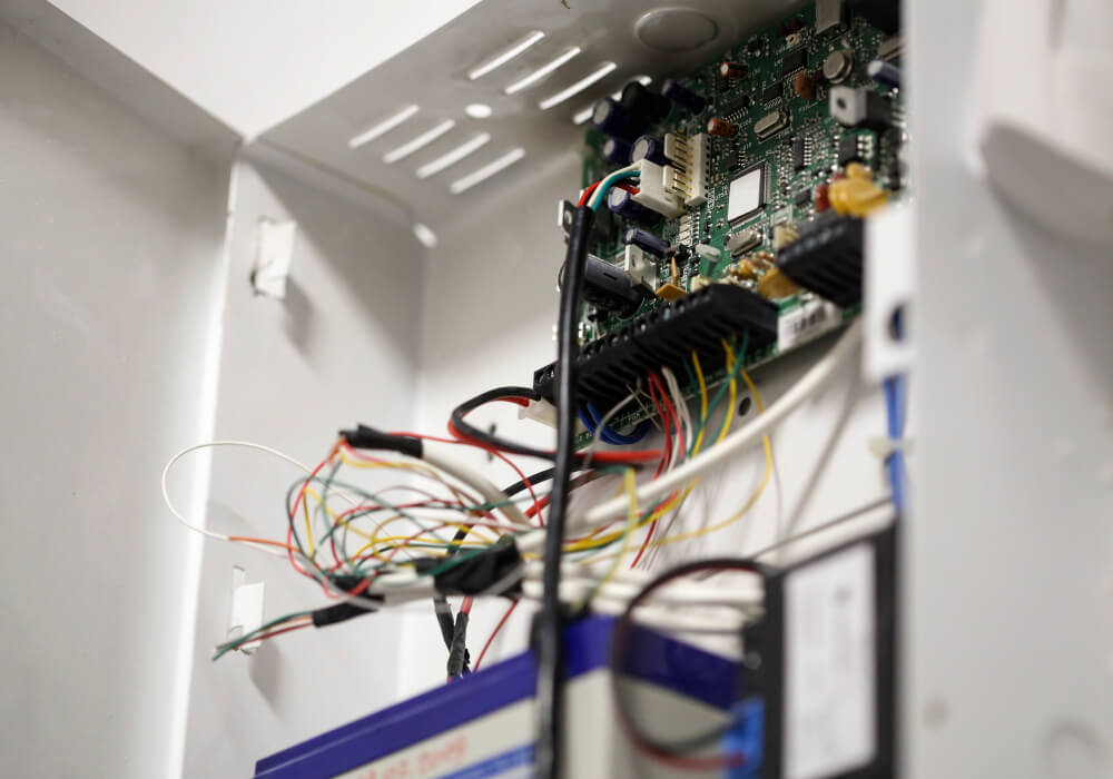 Alarm panel wiring checked during a system takeover